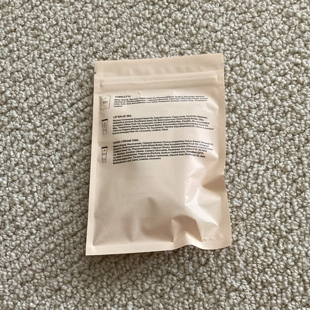 Therabody Arrive Revived Wellness Pack Towelette Lip Balm Hair Cream